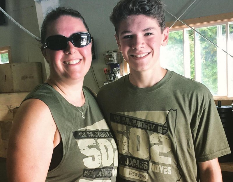 Mother and son doing The 502 workout